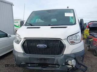 2021 Ford Transit Cargo with VIN 1FTBR1Y81MKA25014, listed as a IAAI auction lot 41594717 with 49,983 mi miles and . Bid and sale history available at DreamBid. Image 12.