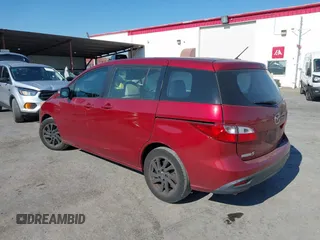 2014 Mazda 5 Sport with VIN JM1CW2BL9E0168662, listed as a IAAI auction lot 42726429 with 145,190 mi miles and . Bid and sale history available at DreamBid. Image 3.