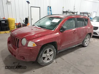 2010 Jeep Compass Sport with VIN 1J4NF4FB2AD506051, listed as a IAAI auction lot 41552084 with 218,785 mi miles. Bid and sale history available at carsss.com. Image 2.