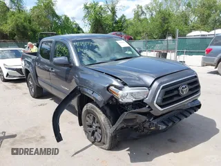 2022 Toyota Tacoma SR with VIN 3TMCZ5AN2NM525706, listed as a IAAI auction lot 42155955 with 23,795 mi miles and . Bid and sale history available at DreamBid. Image 1.