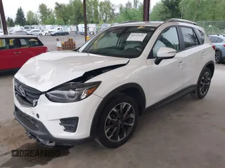 2016 Mazda CX-5 Grand Touring with VIN JM3KE2DYXG0675619, listed as a IAAI auction lot 42137144 with 106,262 mi miles and . Bid and sale history available at DreamBid. Image 17.