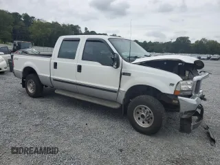 2000 Ford Super Duty F-250 XL with VIN 1FTNW21S1YED90136, listed as a Copart auction lot 71520914 with 378,931 mi miles and Salvage Title. Bid and sale history available at carsss.com. Image 4.