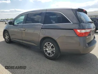 2011 Honda Odyssey EX-L with VIN 5FNRL5H61BB056652, listed as a Copart auction lot 54774015 with 233,125 mi miles and Salvage Title. Bid and sale history available at DreamBid. Image 2.