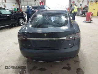 2014 Tesla Model S 60 with VIN 5YJSA1H16EFP52853, listed as a IAAI auction lot 41941989 with 132,038 mi miles and . Bid and sale history available at DreamBid. Image 16.