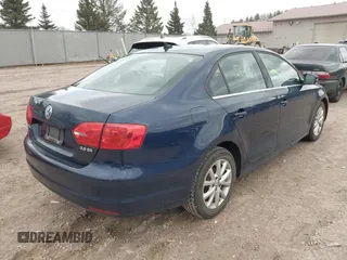 2013 Volkswagen Jetta Sedan SE w/Convenience/Sunroof with VIN 3VWBP7AJ3DM357905, listed as a IAAI auction lot 42065633 with 124,015 mi miles. Bid and sale history available at carsss.com. Image 4.