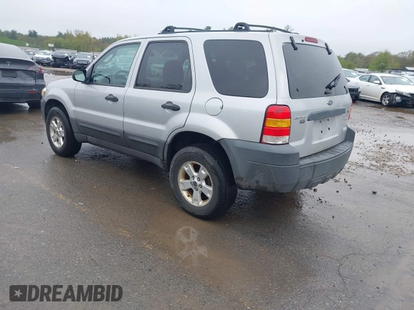 2005 Ford Escape XLT with VIN 1FMCU93115KC10947, listed as a IAAI auction lot 42215066 with 128,475 mi miles and . Bid and sale history available at DreamBid. Image 3.