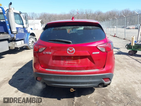 2014 Mazda CX-5 Touring with VIN JM3KE2CY2E0374440, listed as a IAAI auction lot 41634144 with 106,145 mi miles and . Bid and sale history available at DreamBid. Image 17.