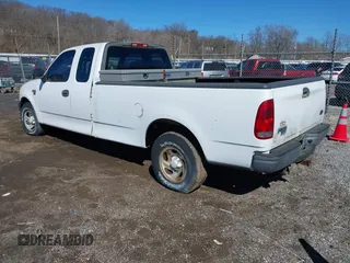 2002 Ford F-150 XL with VIN 1FTRX17L72NA76720, listed as a IAAI auction lot 41738935 with 92,506 mi miles. Bid and sale history available at carsss.com. Image 3.