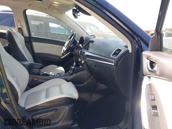 2016 Mazda CX-5 Grand Touring z VIN JM3KE2DY3G0797321, wystawiony jako IAAI lot #42017174 z przebiegiem 65 505 mil mil oraz . Historia ofert i sprzedaży dostępna na DreamBid. Obrazek 5.