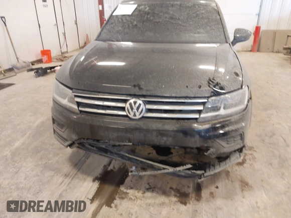 2019 Volkswagen Tiguan S with VIN 3VV0B7AX3KM182311, listed as a IAAI auction lot 41727114 with 98,035 mi miles and . Bid and sale history available at DreamBid. Image 6.