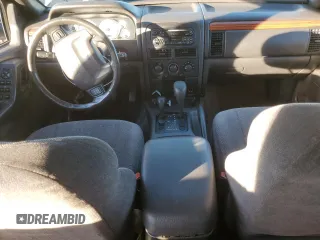1999 Jeep Grand Cherokee Laredo with VIN 1J4GW58NXXC747537, listed as a Copart auction lot 87310234 with Not provided miles and Salvage title. Bid and sale history available at DreamBid. Image 8.
