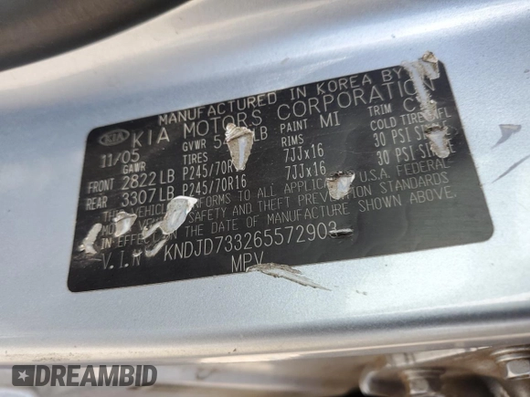 2006 Kia Sorento LX z VIN KNDJD733265572903, wystawiony jako Copart lot #56123945 z przebiegiem 185 664 mil mil oraz Szkoda całkowita • Salvage title. Historia ofert i sprzedaży dostępna na DreamBid. Obrazek 13.