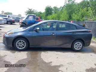 2016 Toyota Prius Two z VIN JTDKBRFU2G3014010, wystawiony jako IAAI lot #42254617 z przebiegiem 171 521 mil mil oraz . Historia ofert i sprzedaży dostępna na DreamBid. Obrazek 14.