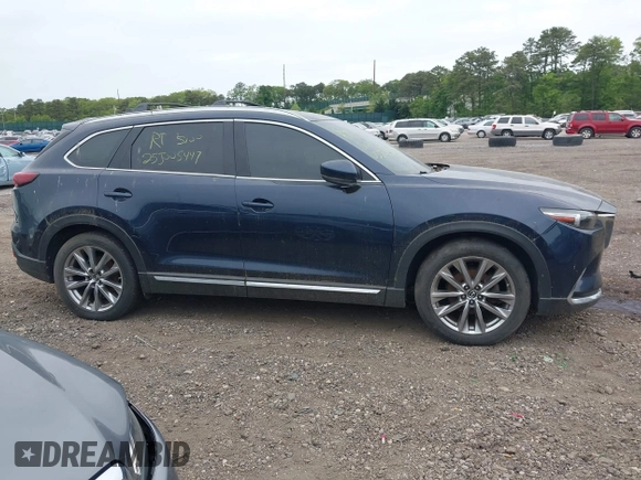 2018 Mazda CX-9 Grand Touring with VIN JM3TCBDY8J0209737, listed as a IAAI auction lot 42374826 with Not provided miles and . Bid and sale history available at DreamBid. Image 12.