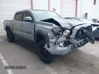 2021 Toyota Tacoma SR z VIN 5TFCZ5AN5MX281428, wystawiony jako IAAI lot #41893437 z przebiegiem 36 204 mil mil oraz . Historia ofert i sprzedaży dostępna na DreamBid. Obrazek 1.