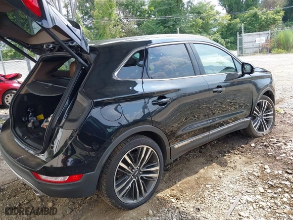 2015 Lincoln MKC with VIN 5LMTJ2AH3FUJ07208, listed as a IAAI auction lot 40050796 with 101,296 mi miles. Bid and sale history available at carsss.com. Image 4.