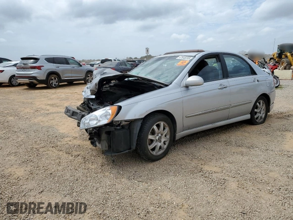 2005 Kia Spectra LX with VIN KNAFE121255202207, listed as a Copart auction lot 47648205 with 0 mi miles and Salvage Title. Bid and sale history available at carsss.com. Image 1.