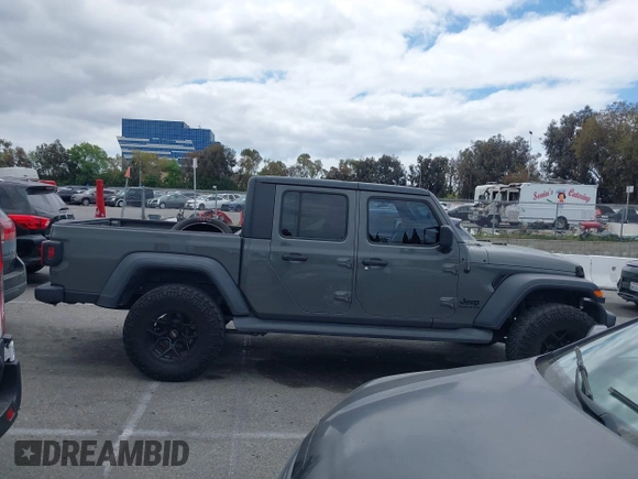 2020 Jeep Gladiator Sport S z VIN 1C6HJTAG4LL153441, wystawiony jako IAAI lot #42052329 z przebiegiem 34 660 mil mil oraz . Historia ofert i sprzedaży dostępna na DreamBid. Obrazek 13.