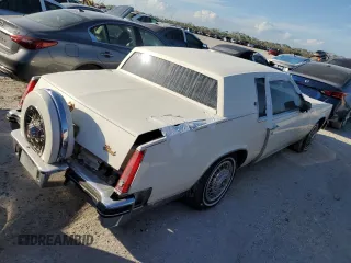1985 Cadillac Eldorado z VIN 1G6EL5782FE630140, wystawiony jako Copart lot #76367454 z przebiegiem 29 850 mil mil oraz Szkody całkowita. Historia ofert i sprzedaży dostępna na DreamBid. Obrazek 3.