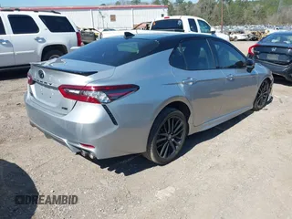 2022 Toyota Camry TRD with VIN 4T1KZ1AK8NU061810, listed as a IAAI auction lot 41769584 with 79,709 mi miles and . Bid and sale history available at DreamBid. Image 4.