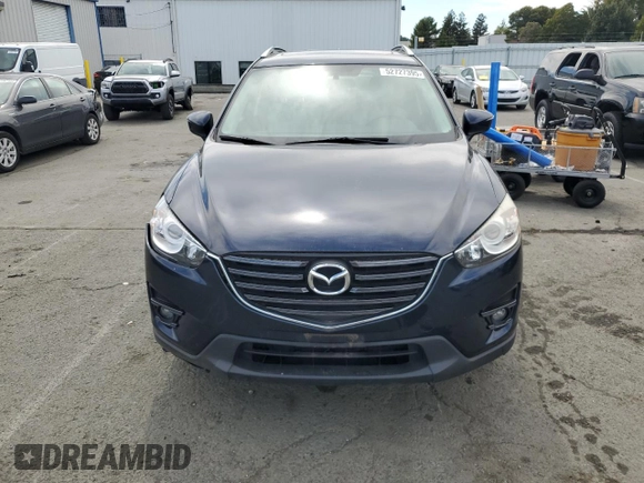 2016 Mazda CX-5 Grand Touring with VIN JM3KE4DY4G0750939, listed as a Copart auction lot 52727395 with 72,428 mi miles and Salvage Title. Bid and sale history available at carsss.com. Image 5.