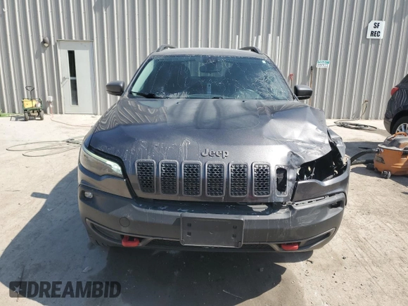 2019 Jeep Cherokee Trailhawk with VIN 1C4PJMBX0KD361639, listed as a Copart auction lot 60549865 with 95,888 mi miles and Salvage title. Bid and sale history available at DreamBid. Image 5.