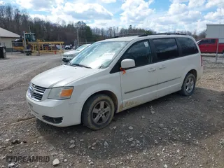 2010 Dodge Grand Caravan SXT with VIN 2D4RN5D12AR120322, listed as a IAAI auction lot 41876293 with 1 mi miles. Bid and sale history available at carsss.com. Image 2.