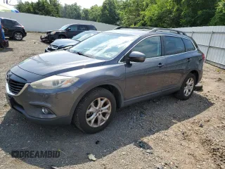 2015 Mazda CX-9 Touring with VIN JM3TB3CV9F0458264, listed as a Copart auction lot 63001905 with 117,852 mi miles and Salvage title. Bid and sale history available at DreamBid. Image 1.
