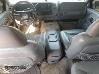 1999 Chevrolet Suburban with VIN 1GNEC16R9XJ490863, listed as a Copart auction lot 65938594 with 176,391 mi miles and Salvage Title. Bid and sale history available at carsss.com. Image 8.