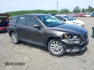 2016 Mazda CX-5 Sport with VIN JM3KE4BY8G0785812, listed as a IAAI auction lot 42324083 with 57,405 mi miles and . Bid and sale history available at DreamBid. Image 1.