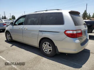 2006 Honda Odyssey EX with VIN 5FNRL38406B453939, listed as a Copart auction lot 62784155 with 86,635 mi miles and Clean title. Bid and sale history available at DreamBid. Image 2.