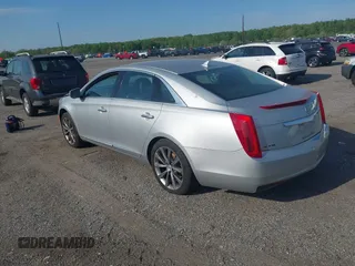 2013 Cadillac XTS with VIN 2G61N5S31D9135710, listed as a IAAI auction lot 42002480 with 162,029 mi miles. Bid and sale history available at carsss.com. Image 3.