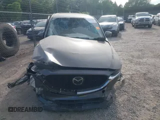 2018 Mazda CX-5 Grand Touring z VIN JM3KFADM5J1365772, wystawiony jako IAAI lot #42251805 z przebiegiem 44 599 mil mil oraz . Historia ofert i sprzedaży dostępna na DreamBid. Obrazek 11.