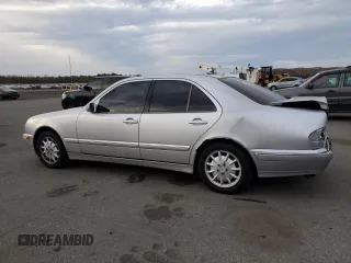 2000 Mercedes-Benz E-Class with VIN WDBJF65J8YB153103, listed as a Copart auction lot 80986234 with 144,205 mi miles and Salvage Title. Bid and sale history available at carsss.com. Image 2.
