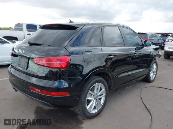 2018 Audi Q3 Premium z VIN WA1BCCFS8JR006212, wystawiony jako IAAI lot #42208285 z przebiegiem 96 571 mil mil oraz . Historia ofert i sprzedaży dostępna na DreamBid. Obrazek 4.