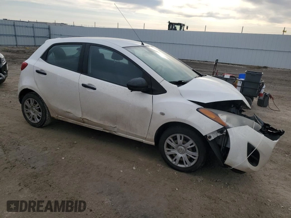 2012 Mazda 2 Sport with VIN JM1DE1KY8C0145089, listed as a Copart auction lot 52093925 with 211,282 mi miles and Salvage Title. Bid and sale history available at DreamBid. Image 4.