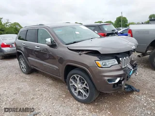 2020 Jeep Grand Cherokee Overland with VIN 1C4RJECG8LC323824, listed as a IAAI auction lot 41757922 with 64,792 mi miles. Bid and sale history available at carsss.com. Image 1.