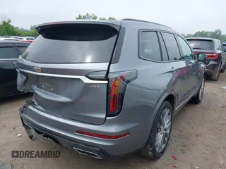 2021 Cadillac XT6 Sport with VIN 1GYKPGRS6MZ128112, listed as a IAAI auction lot 42415342 with 57,680 mi miles and . Bid and sale history available at DreamBid. Image 4.
