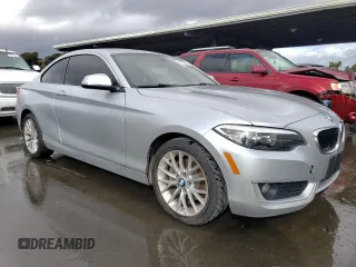 2015 BMW 2 Series 228i with VIN WBA1F5C57FV256927, listed as a Copart auction lot 41628804 with 125,695 mi miles. Bid and sale history available at carsss.com. Image 4.