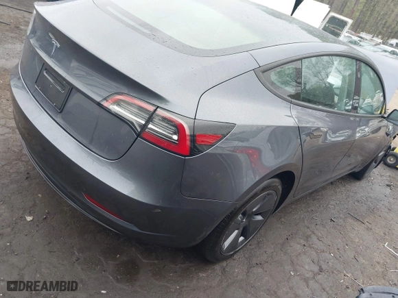 2023 Tesla Model 3 with VIN 5YJ3E1EA7PF642913, listed as a IAAI auction lot 41898249 with 26,394 mi miles. Bid and sale history available at carsss.com. Image 4.