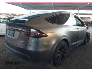 2022 Tesla Model X Plaid z VIN 7SAXCBE69NF352875, wystawiony jako IAAI lot #41964970 z przebiegiem 34 065 mil mil oraz . Historia ofert i sprzedaży dostępna na DreamBid. Obrazek 20.