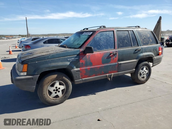 1995 Jeep Grand Cherokee Laredo with VIN 1J4FX58S5SC741328, listed as a Copart auction lot 82034594 with 260,398 mi miles and Clean Title. Bid and sale history available at carsss.com. Image 1.