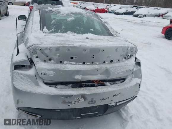 2014 Lincoln MKZ z VIN 3LN6L2JK9ER813109, wystawiony jako IAAI lot #41444866 z przebiegiem 128 613 mil mil oraz . Historia ofert i sprzedaży dostępna na DreamBid. Obrazek 17.