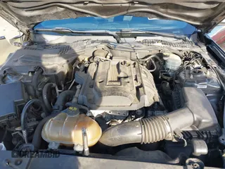 2015 Ford Mustang EcoBoost z VIN 1FA6P8TH7F5351477, wystawiony jako IAAI lot #41378347 z przebiegiem 104 755 mil mil oraz . Historia ofert i sprzedaży dostępna na DreamBid. Obrazek 10.