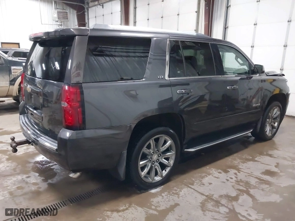 2016 Chevrolet Tahoe LTZ with VIN 1GNSKCKC7GR455033, listed as a IAAI auction lot 40811560 with 165,845 mi miles. Bid and sale history available at carsss.com. Image 4.