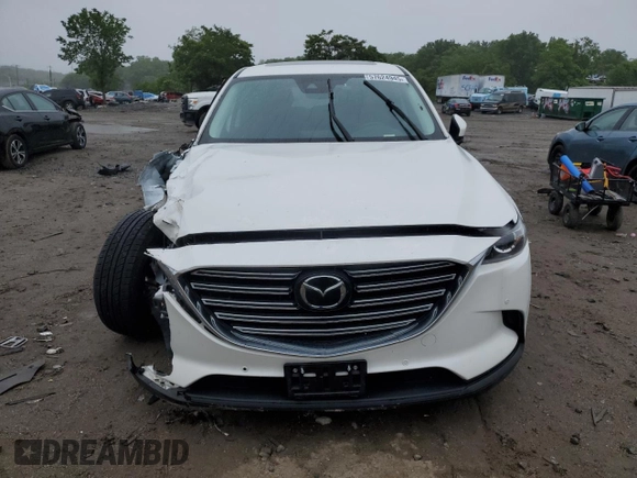 2021 Mazda CX-9 Touring with VIN JM3TCBCY1M0517709, listed as a Copart auction lot 57624945 with 64,081 mi miles and Salvage title. Bid and sale history available at DreamBid. Image 5.