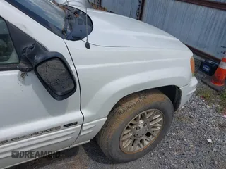 2002 Jeep Grand Cherokee Limited z VIN 1J4GX58N62C195783, wystawiony jako IAAI lot #42745397 z przebiegiem 242 502 mil mil oraz . Historia ofert i sprzedaży dostępna na DreamBid. Obrazek 16.