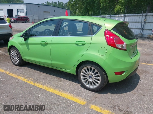 2014 Ford Fiesta Titanium z VIN 3FADP4FJ7EM203322, wystawiony jako IAAI lot #42448840 z przebiegiem 91 901 mil mil oraz . Historia ofert i sprzedaży dostępna na DreamBid. Obrazek 3.