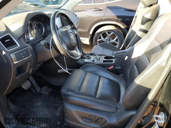 2016 Mazda CX-5 Grand Touring with VIN JM3KE4DY0G0731384, listed as a Copart auction lot 44741695 with 58,727 mi miles and Salvage Title. Bid and sale history available at carsss.com. Image 7.