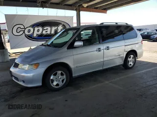 2001 Honda Odyssey EX z VIN 2HKRL18601H559033, wystawiony jako Copart lot #57119025 z przebiegiem 333 068 mil mil oraz Szkoda całkowita • Salvage title. Historia ofert i sprzedaży dostępna na DreamBid. Obrazek 1.